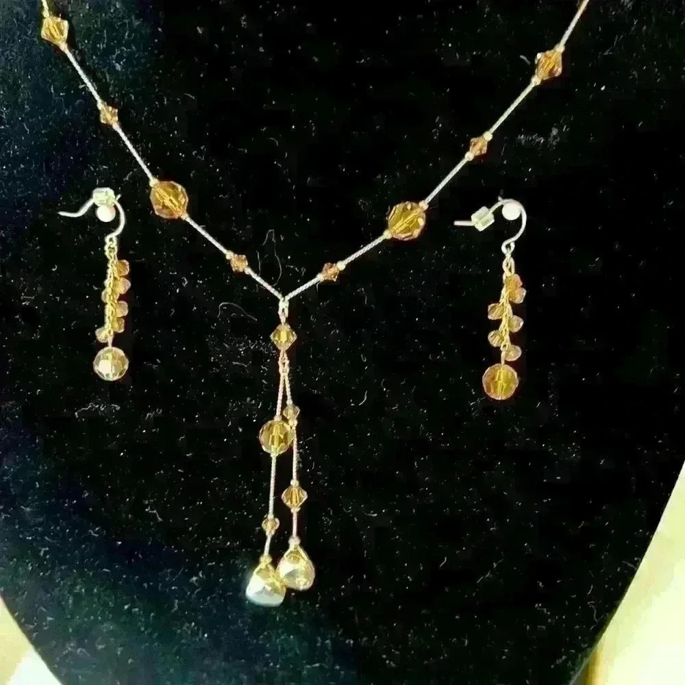 Beautiful gold tone and crystal necklace & earrings